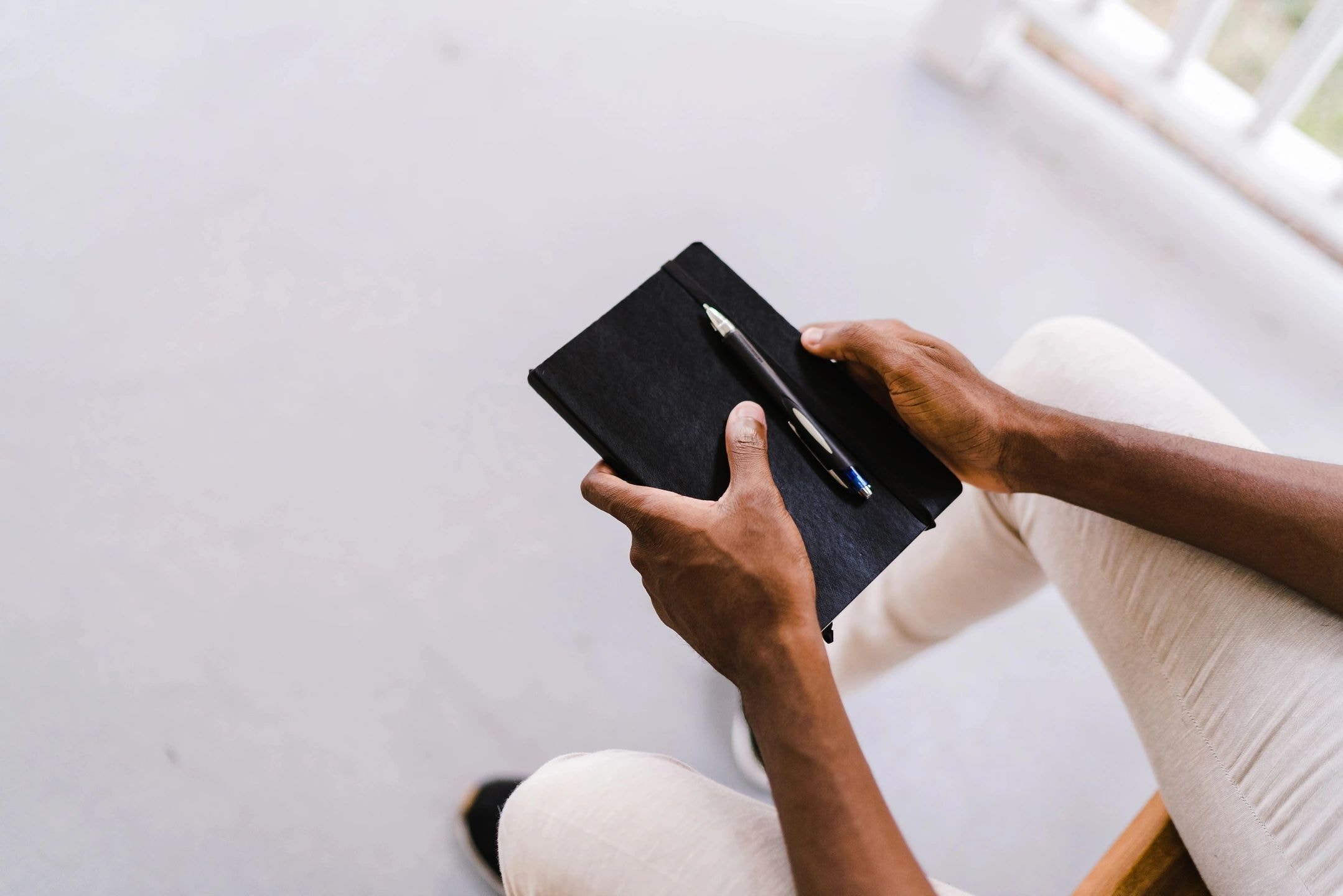 Person holding notebook — representing our commitment to clients